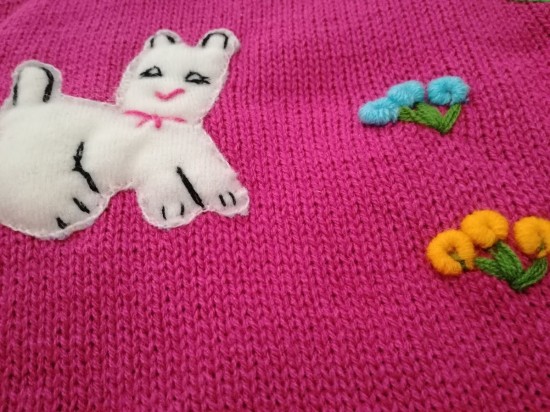 Gebreide meisje poncho fuchsia 1